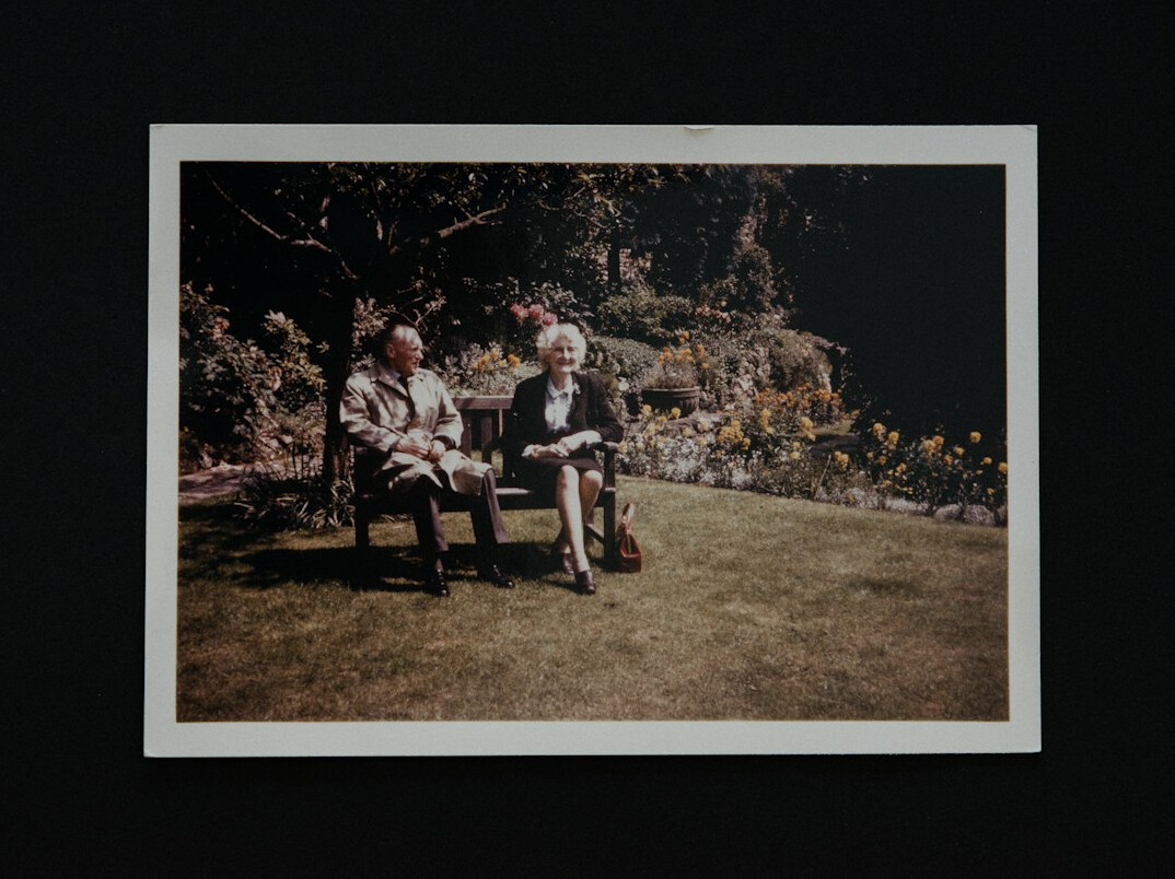 elderly friends chatting in garden