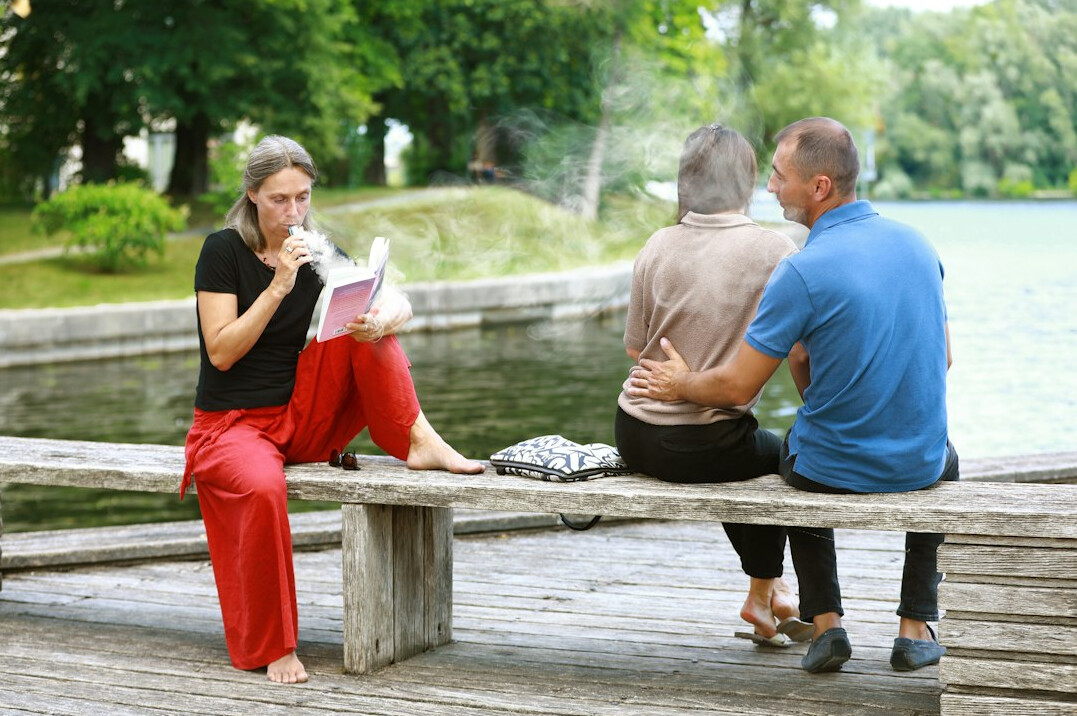 senior friends talking in park