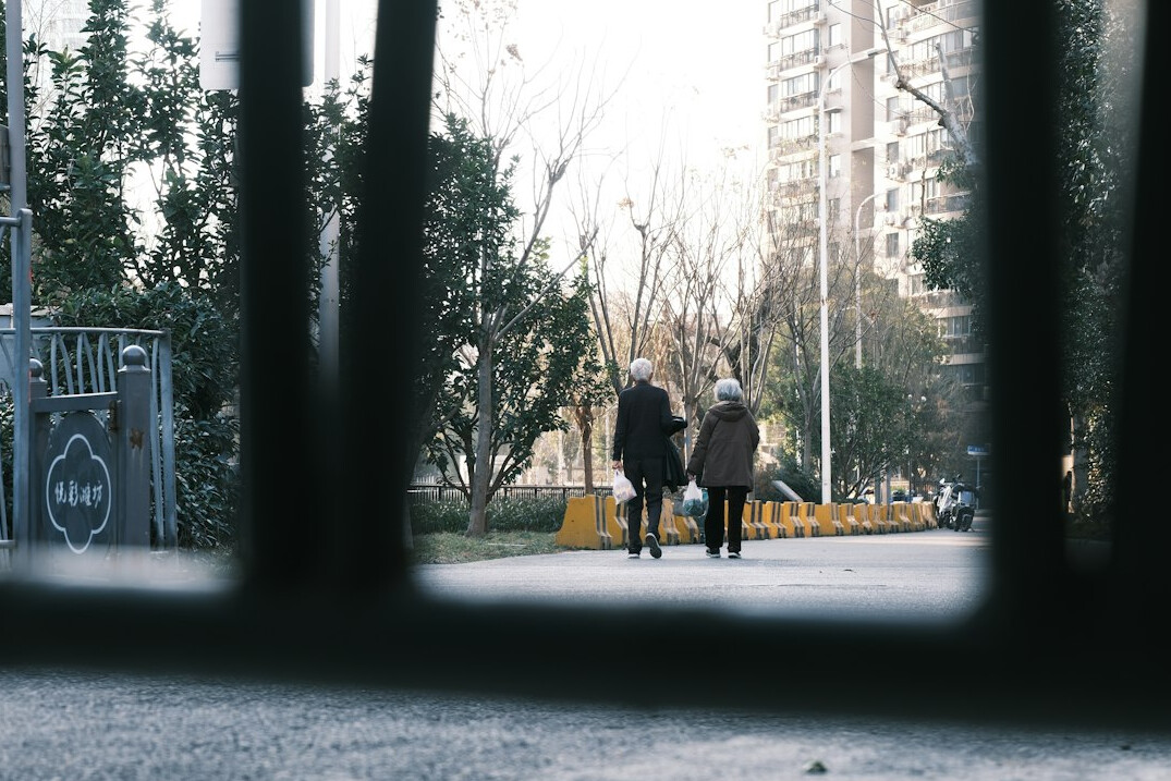 senior couple walking in neighborhood